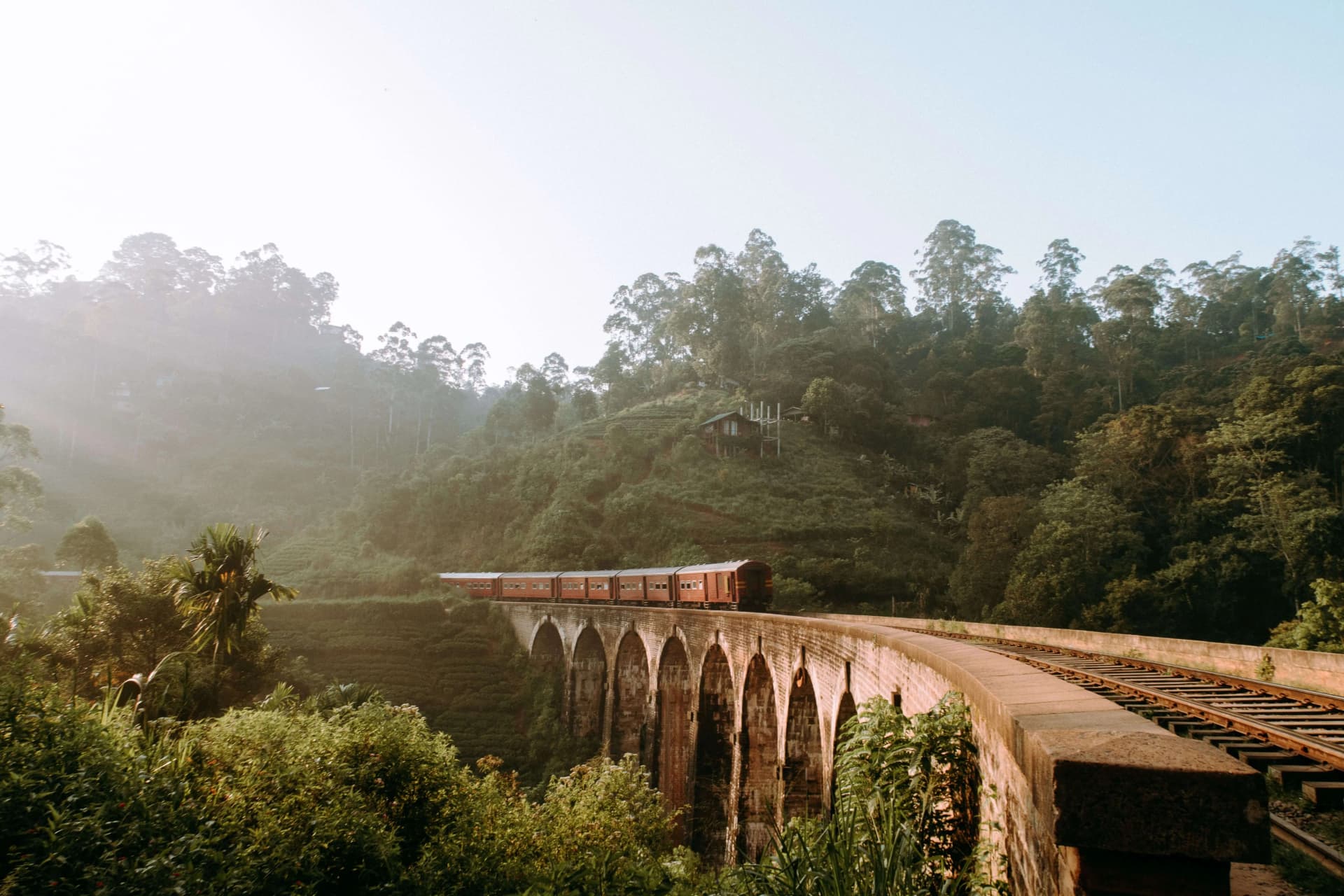 Nine Arch Bridge surrounded by lush green hills in Ella, Sri Lanka